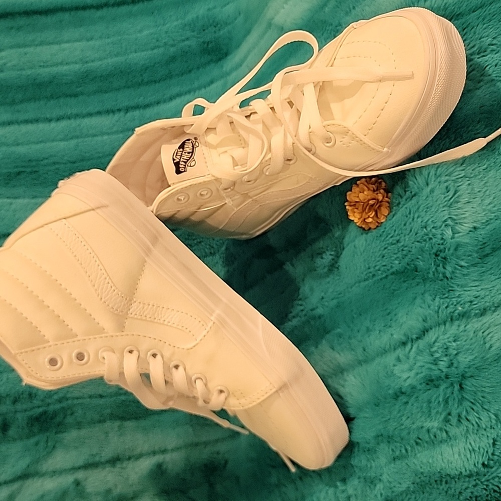 A pair of Van' sneakers. White, High top, never wore.